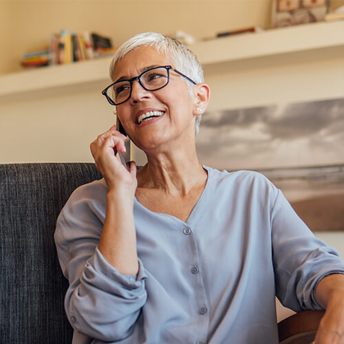 Mature woman with short hair on the phone
